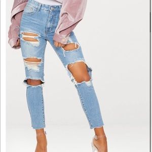 Light wash extreme distressed boyfriend jeans